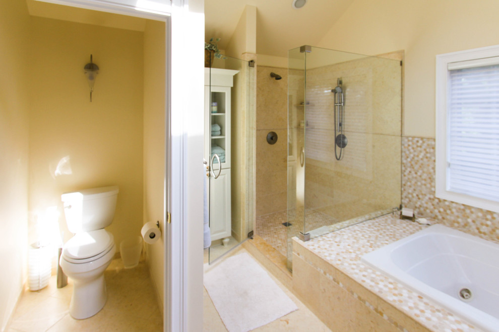 Photo of a large eclectic master bathroom in Philadelphia with beaded inset cabinets, white cabinets, a corner tub, a corner shower, a two-piece toilet, multi-coloured tile, mosaic tile, beige walls, porcelain floors, an undermount sink, granite benchtops, beige floor, a hinged shower door and beige benchtops.