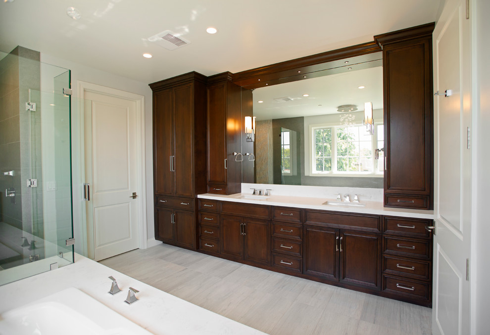 Inspiration for a mid-sized contemporary master bathroom in Los Angeles with recessed-panel cabinets, dark wood cabinets, a corner shower, white walls, painted wood floors, an undermount sink and quartzite benchtops.