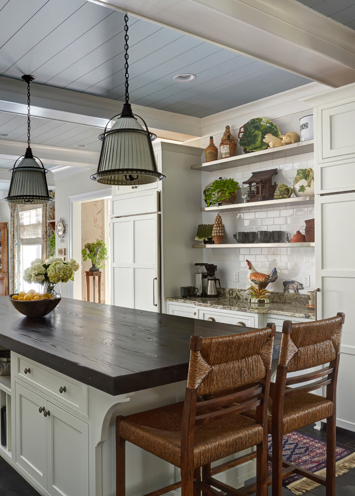 Example of a large transitional home design design in Milwaukee
