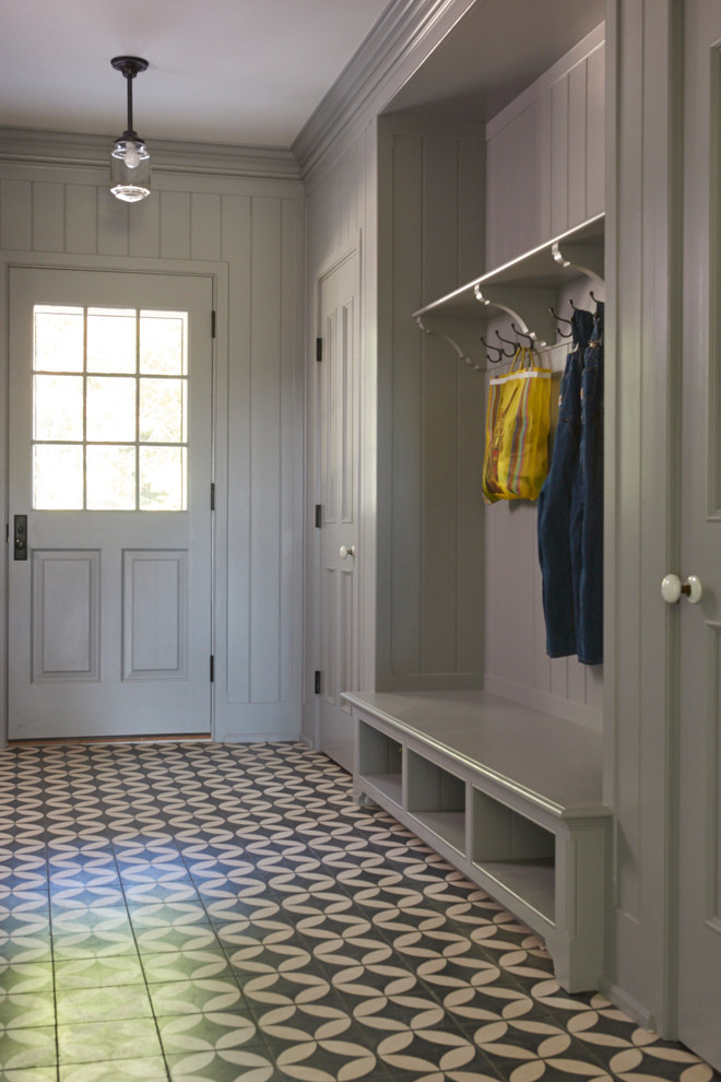Inspiration for a mid-sized country hallway in New York with grey walls and concrete floors.