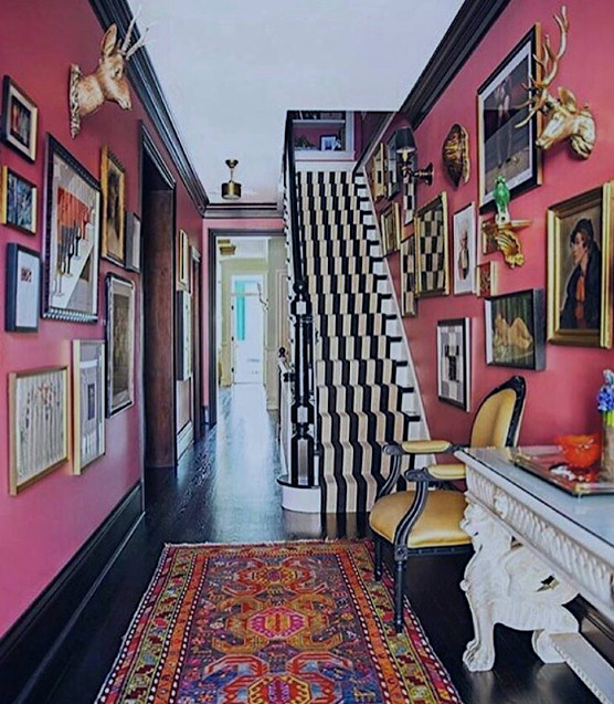 Design ideas for a mid-sized eclectic entry hall in DC Metro with pink walls.