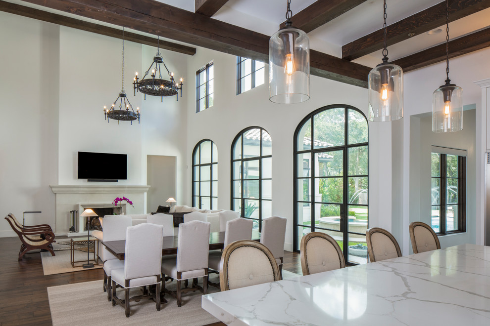 Inspiration for a large mediterranean open plan dining in Austin with dark hardwood floors and brown floor.