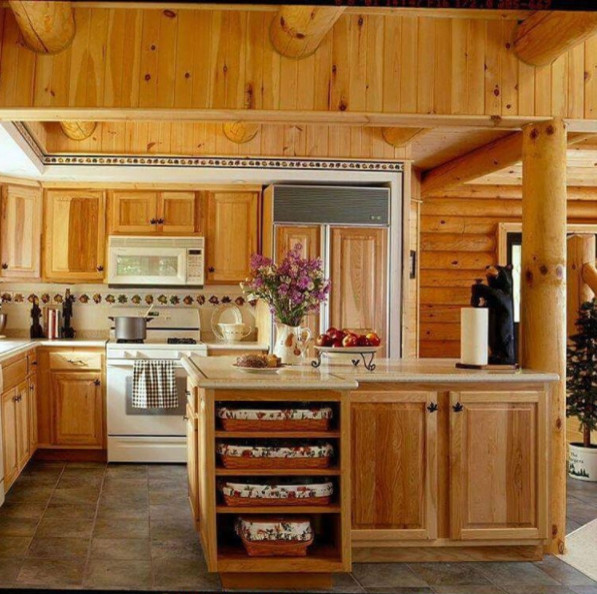 Inspiration for a mid-sized rustic u-shaped medium tone wood floor and brown floor enclosed kitchen remodel in New York with an undermount sink, shaker cabinets, medium tone wood cabinets, granite countertops, multicolored backsplash, stone tile backsplash, stainless steel appliances and an island