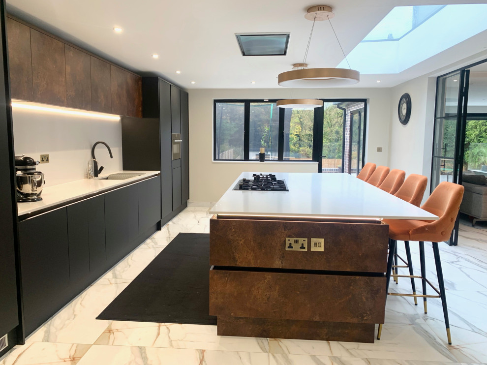 This is an example of a large contemporary kitchen in Hertfordshire with porcelain flooring and an island.