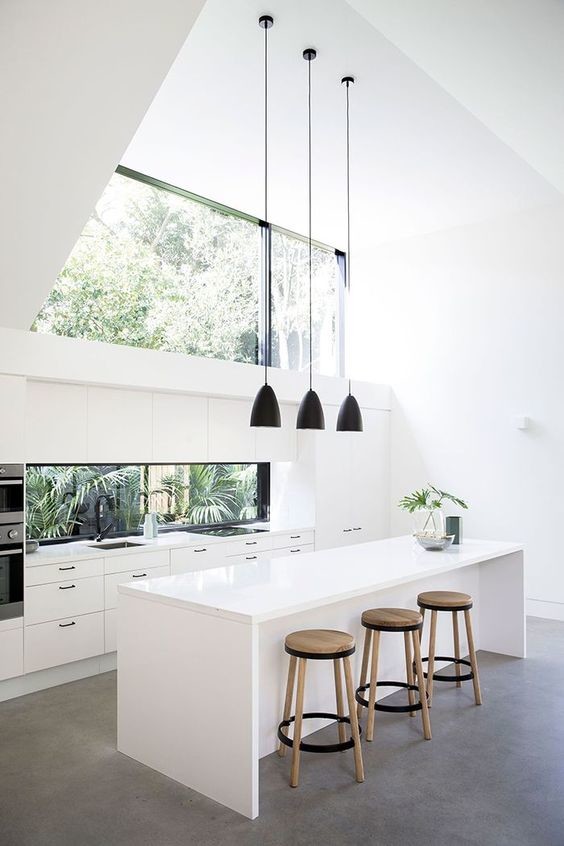 Small modern u-shaped separate kitchen in Austin with a drop-in sink, flat-panel cabinets, white cabinets, zinc benchtops, white splashback, stone tile splashback, panelled appliances, porcelain floors, with island, white floor and white benchtop.