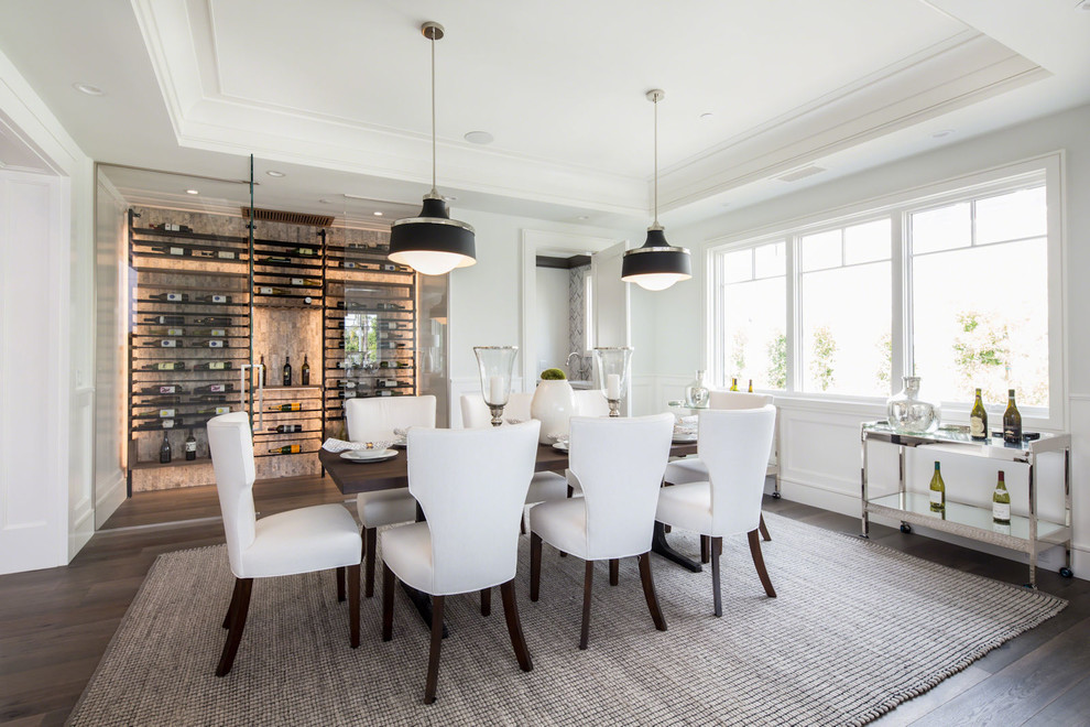 Inspiration for a transitional dining room in Los Angeles with white walls, dark hardwood floors and no fireplace.