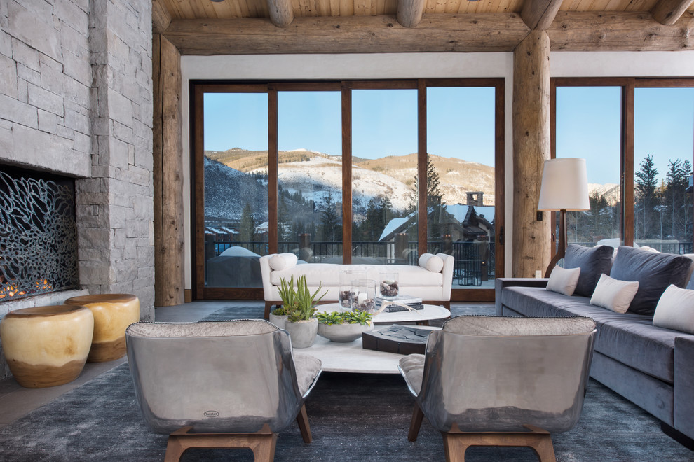 Vail Ski Haus - Large mountain style formal and open concept gray floor living room photo in Denver with a standard fireplace, gray walls, a stone fireplace and no tv