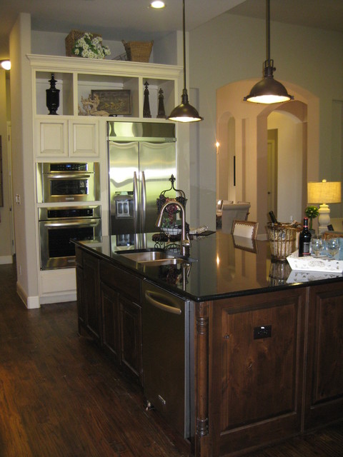 Stained island and painted cabinets by Burrows Cabinets ...