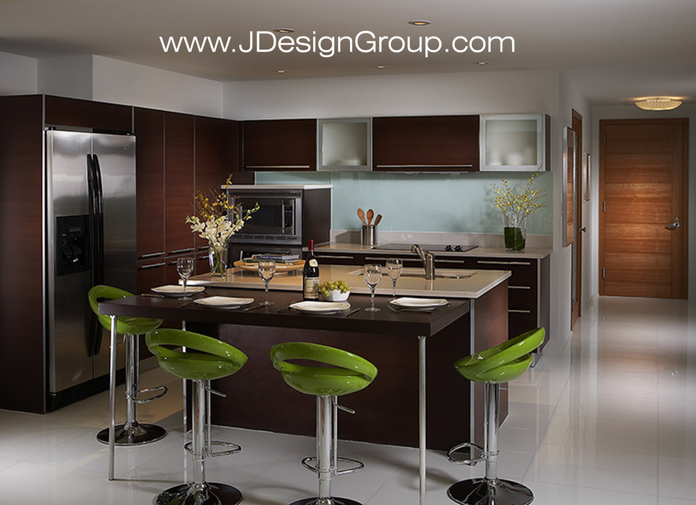 Design ideas for a mid-sized contemporary l-shaped eat-in kitchen in Miami with an undermount sink, flat-panel cabinets, dark wood cabinets, marble benchtops, white splashback, glass sheet splashback, stainless steel appliances, marble floors, with island and white floor.