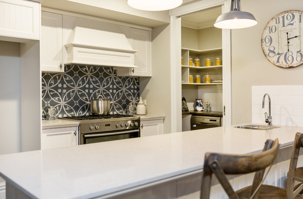 This is an example of a beach style kitchen in Melbourne.
