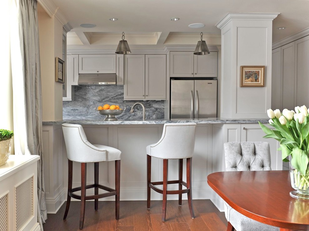 Inspiration for a small galley eat-in kitchen in Montreal with shaker cabinets, grey cabinets, grey splashback, stone slab splashback, stainless steel appliances, an undermount sink and marble benchtops.