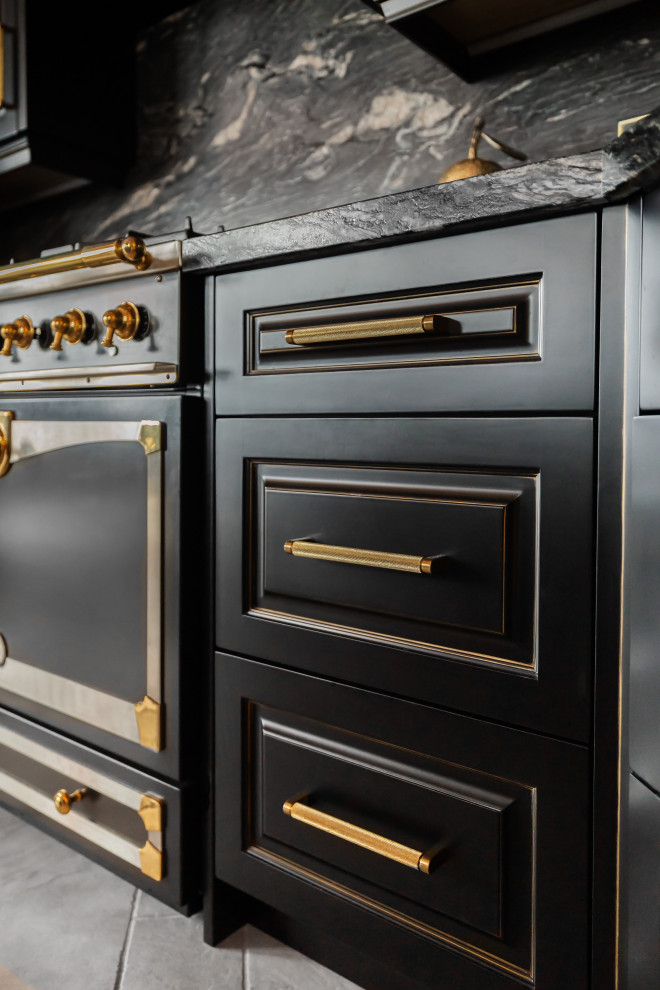 Inspiration for a large eclectic kitchen remodel with raised-panel cabinets, black cabinets, granite countertops, black backsplash, granite backsplash, paneled appliances, an island and black countertops