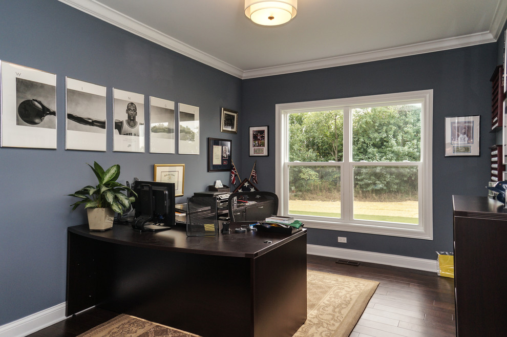 Inspiration for a mid-sized modern home office in Chicago with blue walls, dark hardwood floors and a freestanding desk.
