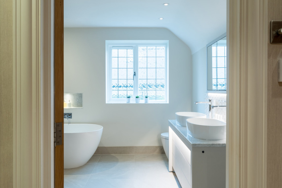 Example of a large trendy master bathroom design in Surrey