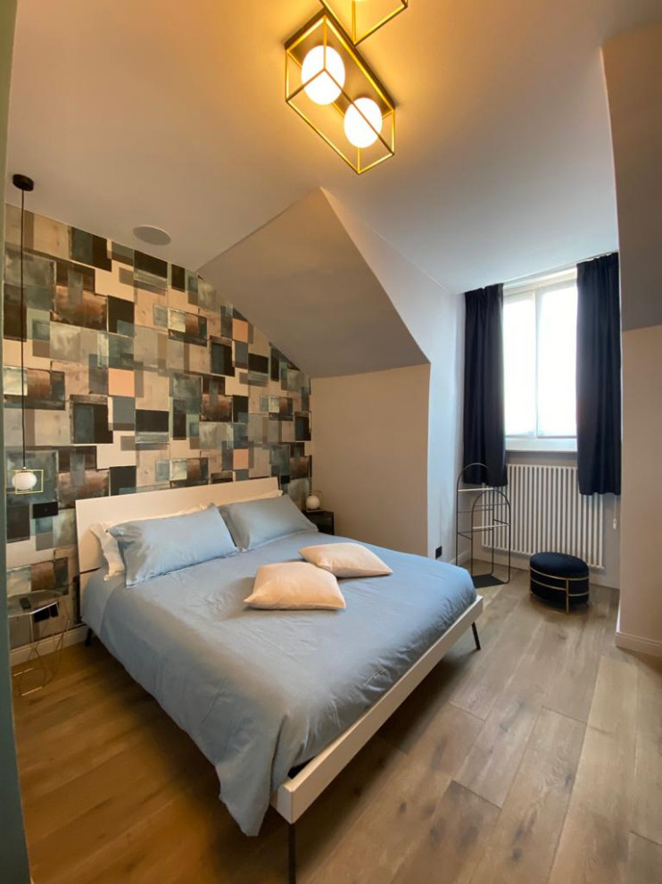 Inspiration for a mid-sized contemporary master bedroom in Turin with grey walls, dark hardwood floors, brown floor and wallpaper.