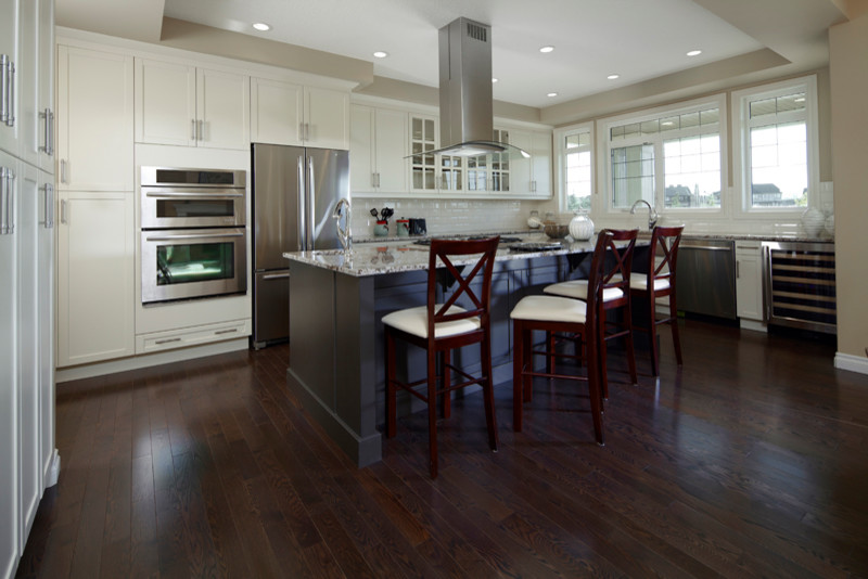 Example of a transitional kitchen design in Calgary