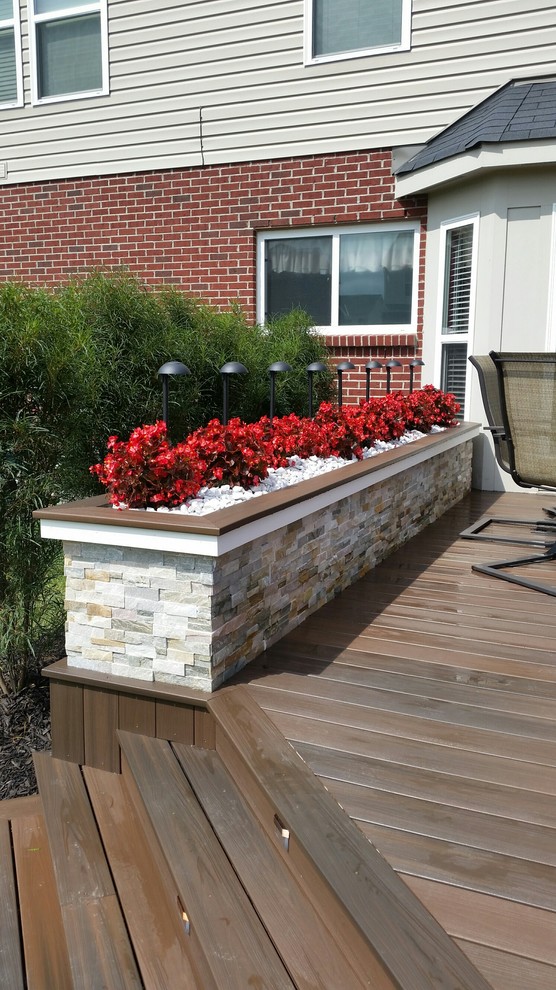 Inspiration for a large timeless backyard deck remodel with no cover