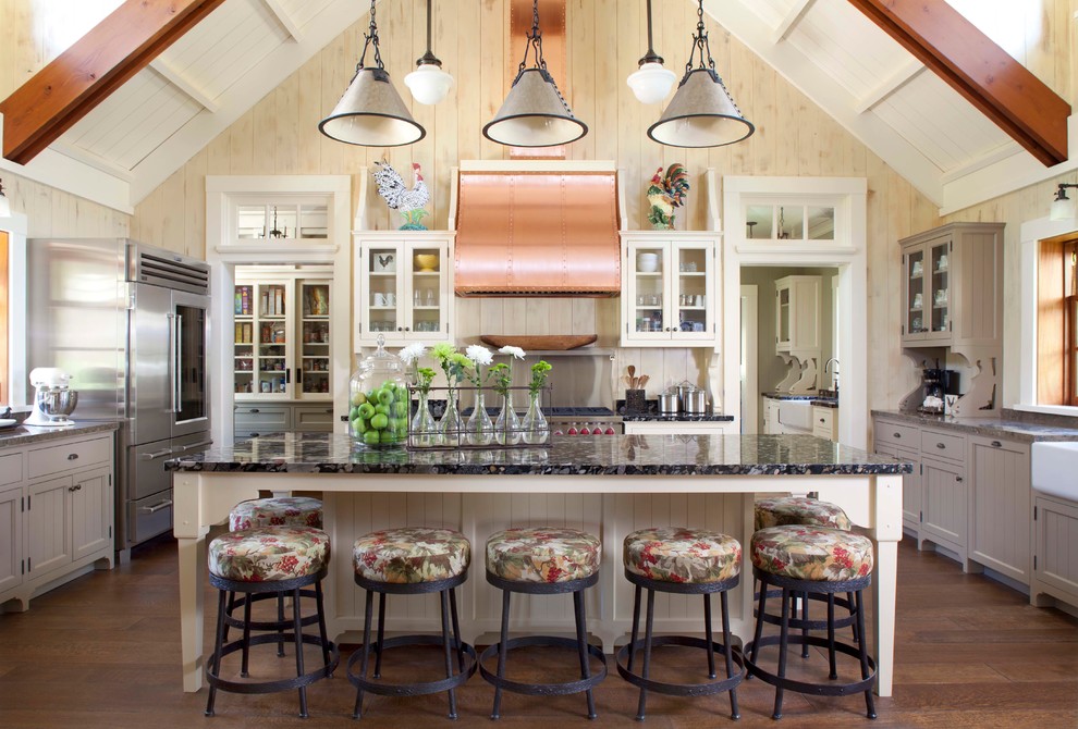 Inspiration for a country u-shaped kitchen in Denver with glass-front cabinets, white cabinets and stainless steel appliances.