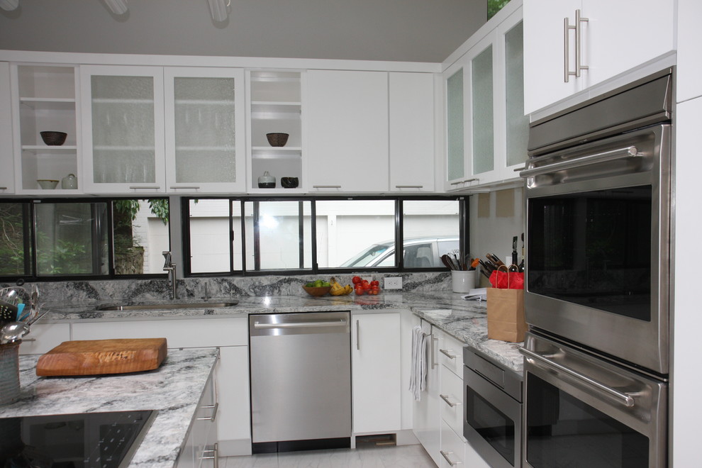 Photo of a mid-sized contemporary galley separate kitchen in New York with an undermount sink, open cabinets, white cabinets, marble benchtops, grey splashback, marble splashback, stainless steel appliances, marble floors, with island and white floor.