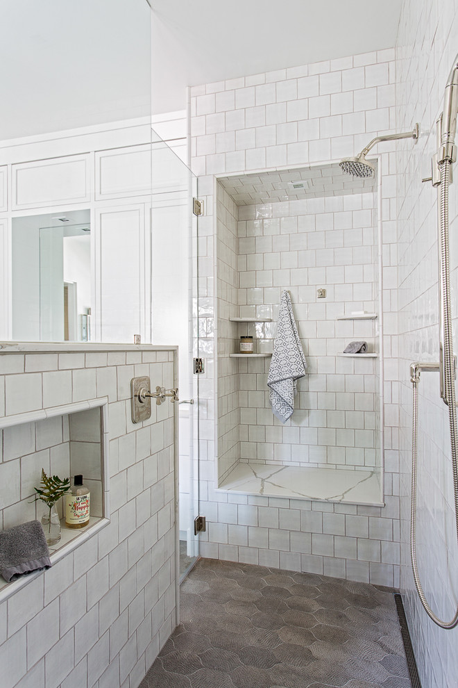 Design ideas for a beach style bathroom in Charleston with a curbless shower, white tile, white walls, brown floor and a hinged shower door.