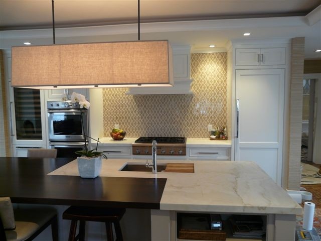 Design ideas for a contemporary kitchen in Boston with marble benchtops and with island.