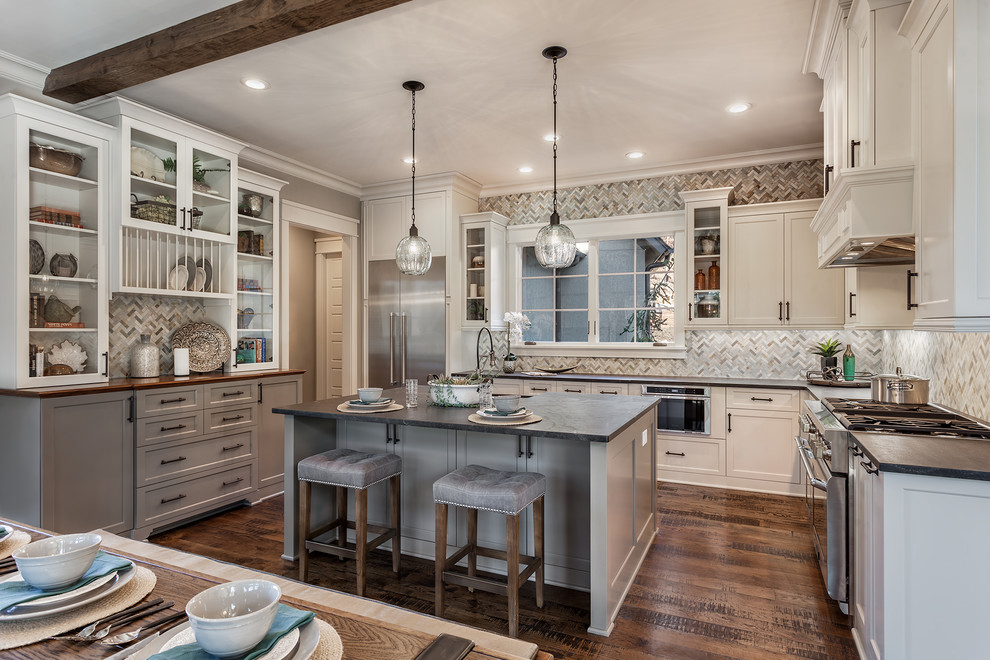 Eat-in kitchen - large rustic u-shaped medium tone wood floor eat-in kitchen idea with white cabinets, stainless steel appliances and an island