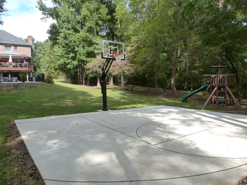 This is an example of a large traditional backyard partial sun outdoor sport court in Charlotte.