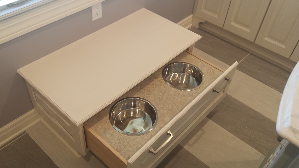 Inspiration for a small transitional u-shaped ceramic tile eat-in kitchen remodel with a double-bowl sink, raised-panel cabinets, white cabinets, marble countertops, white backsplash, subway tile backsplash, stainless steel appliances and an island