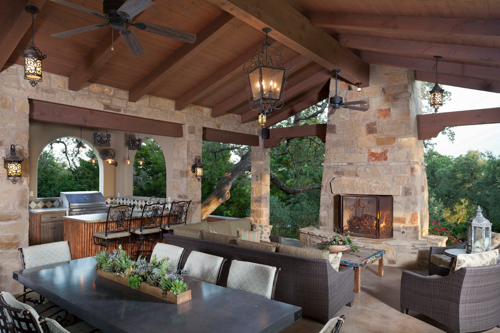 This is an example of a mid-sized mediterranean one-storey beige exterior in Austin with stone veneer and a gable roof.