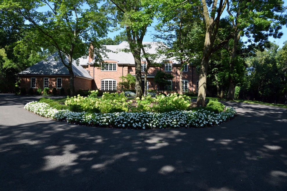 Photo of a huge partial sun front yard landscaping in Chicago.