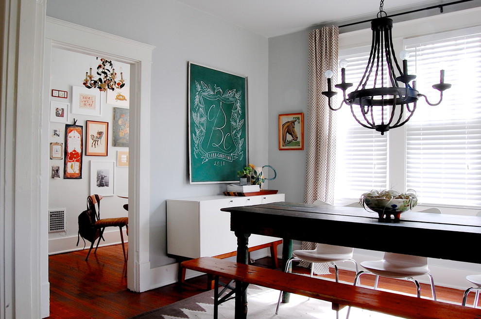 Inspiration for an eclectic dining room in New York with grey walls.