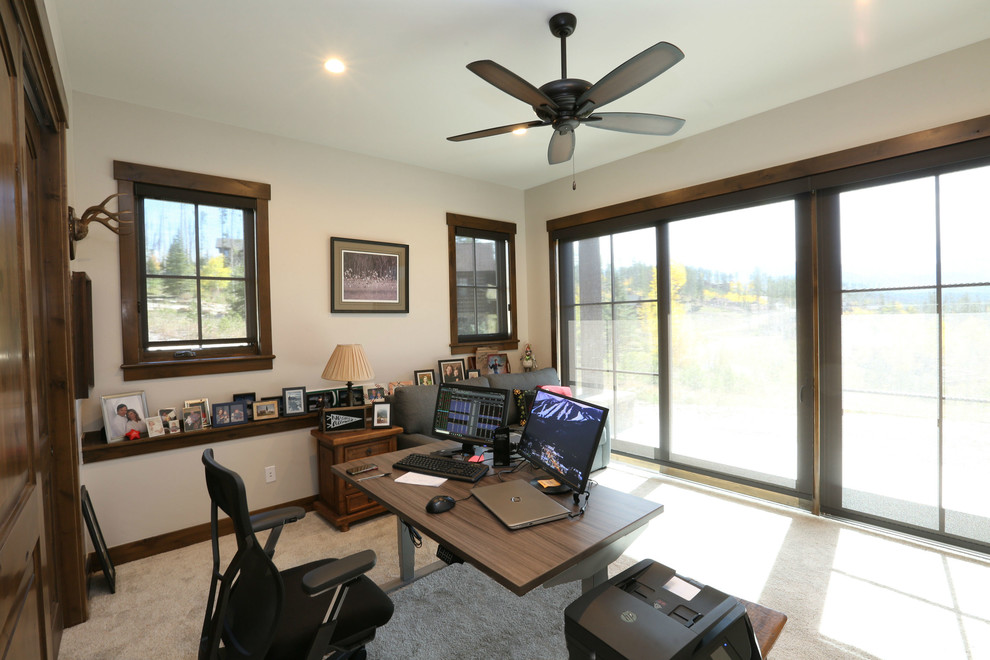 Large country study room in Denver with white walls, carpet, a freestanding desk and white floor.