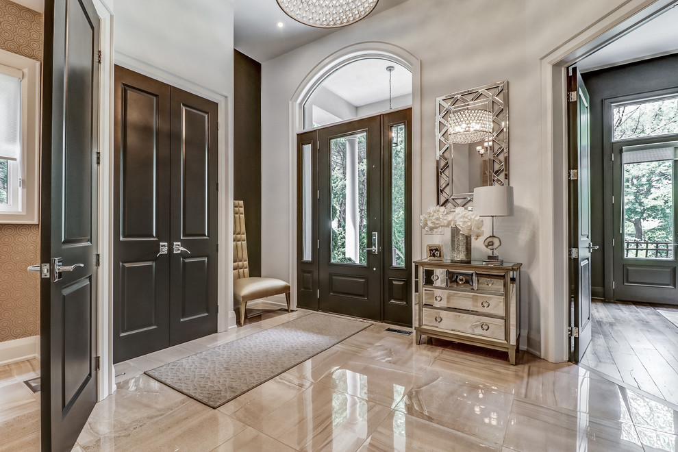 Transitional foyer in Toronto with white walls, a single front door, a brown front door and beige floor.