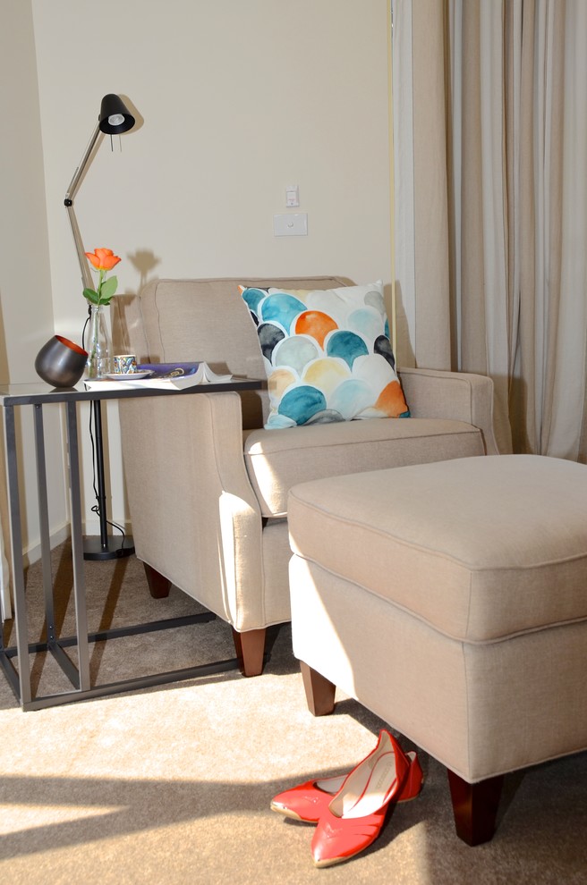 This is an example of a mid-sized contemporary master bedroom in Melbourne with white walls and carpet.