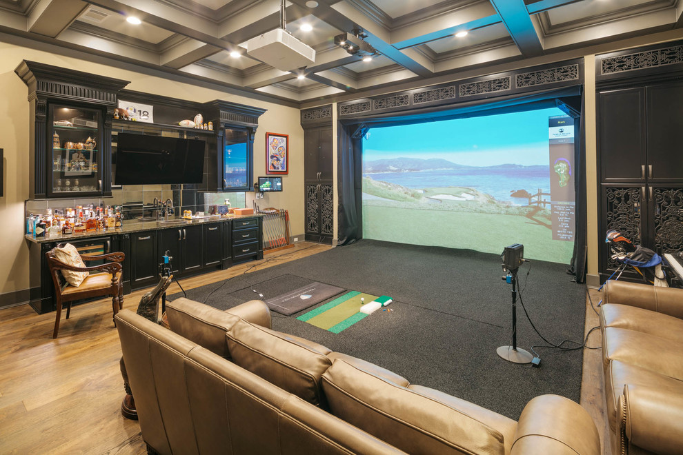 Photo of an expansive transitional open concept home theatre in Houston with beige walls, light hardwood floors, a projector screen and beige floor.