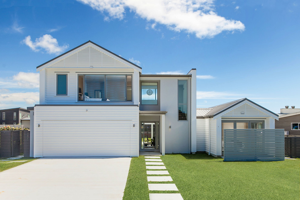 Large contemporary front door in Auckland with white walls, a single front door and a white front door.
