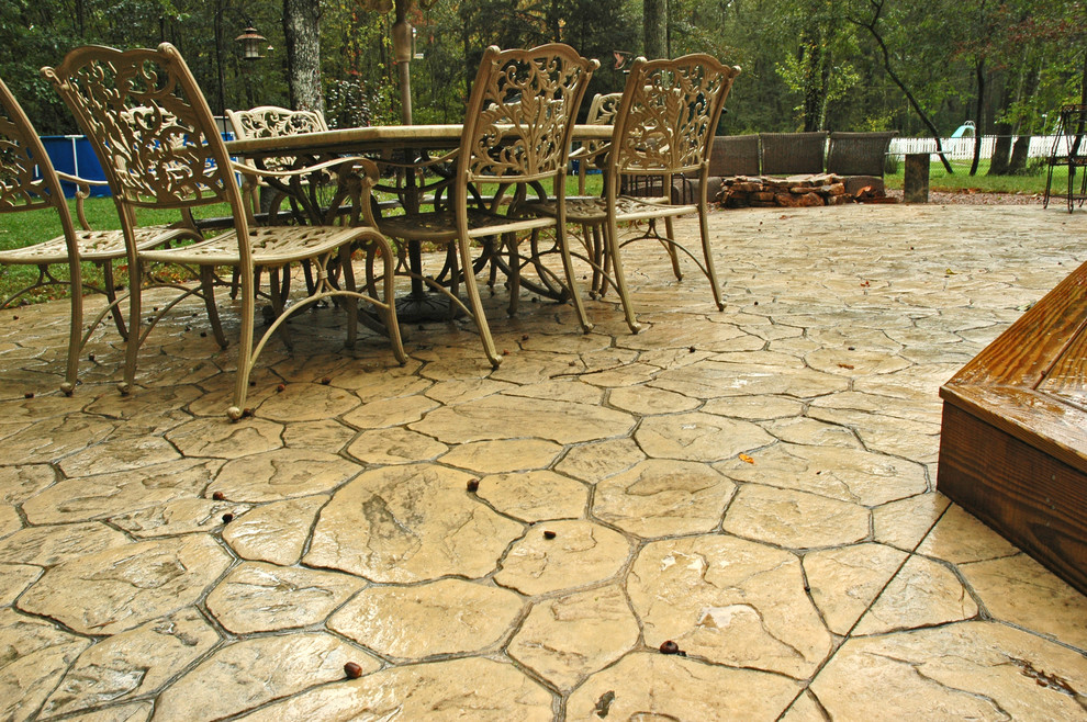 Small backyard patio in Bridgeport with stamped concrete.