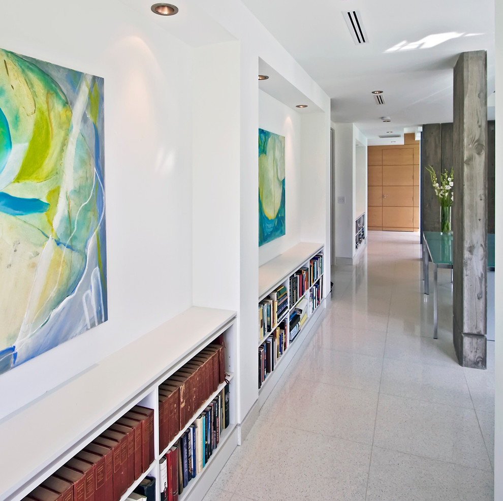 This is an example of a contemporary hallway in Miami with white walls.
