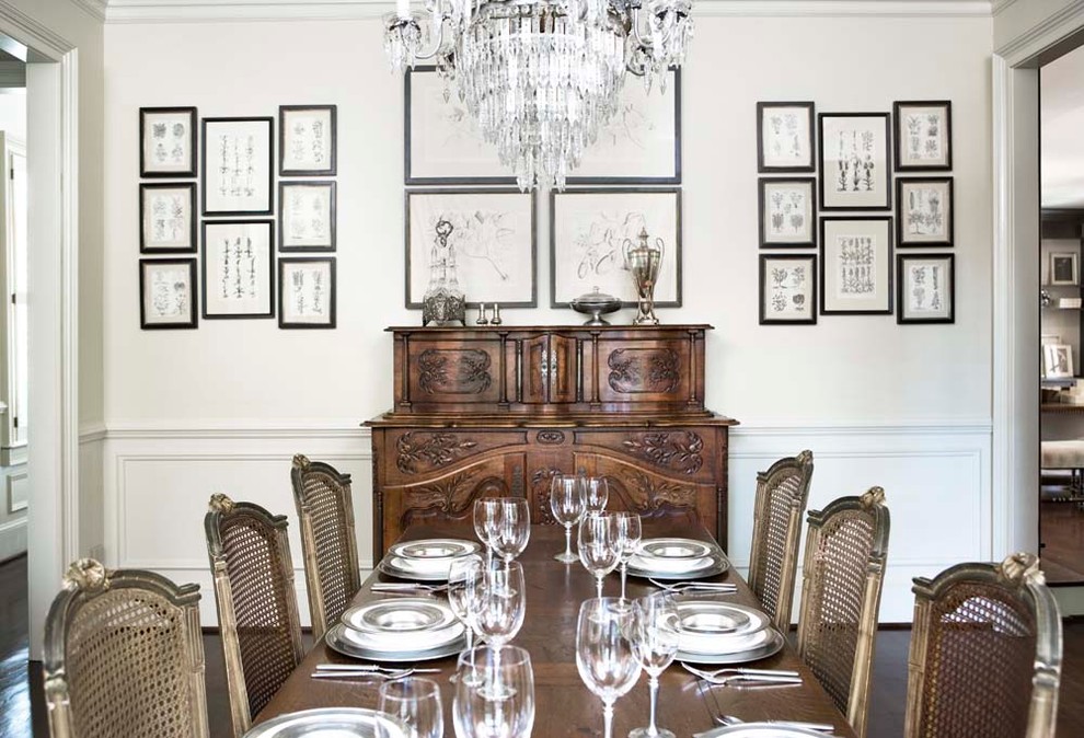 Photo of a large traditional separate dining room in Other with white walls and dark hardwood floors.