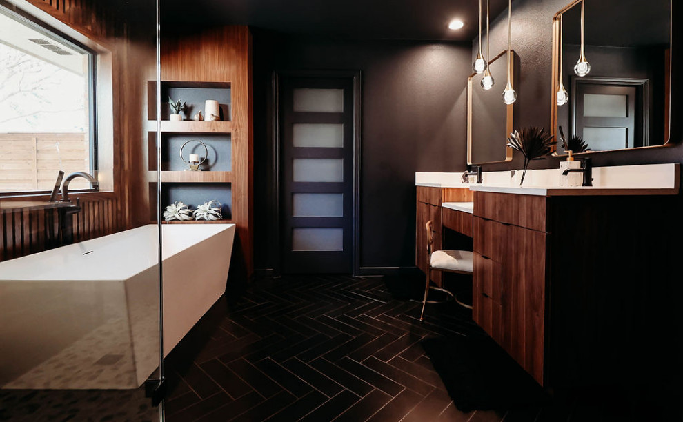 Design ideas for a mid-sized modern master bathroom in Dallas with flat-panel cabinets, medium wood cabinets, a freestanding tub, a corner shower, white tile, porcelain tile, black walls, porcelain floors, an undermount sink, engineered quartz benchtops, black floor, a hinged shower door, white benchtops, a shower seat, a double vanity, a floating vanity and wood walls.