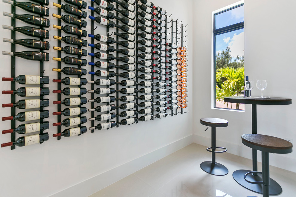 Inspiration for a contemporary wine cellar in Miami with storage racks and beige floor.