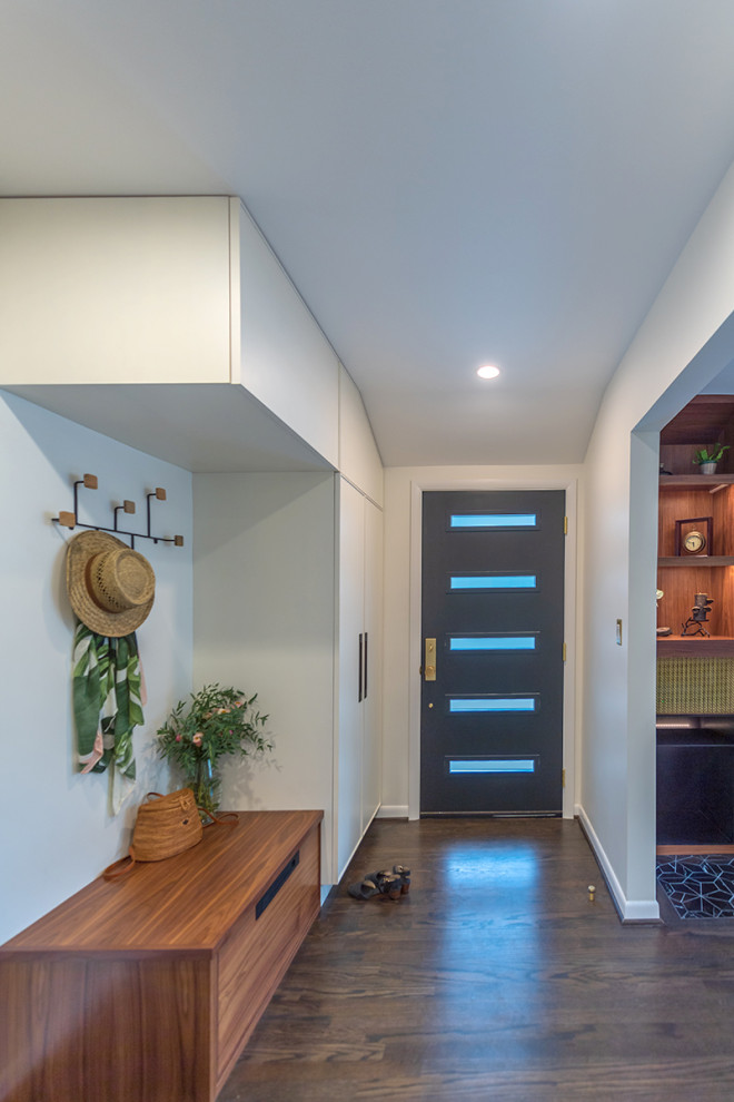 Inspiration for a midcentury front door in Portland with white walls, dark hardwood flooring and a single front door.