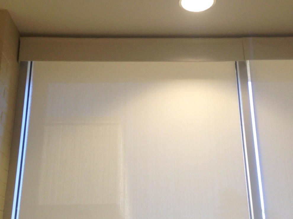 Example of a mid-sized transitional hallway design with white walls
