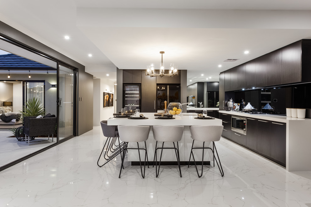 Design ideas for a contemporary l-shaped open plan kitchen in Perth with an undermount sink, flat-panel cabinets, black splashback, glass sheet splashback, black appliances, marble floors, with island and white floor.