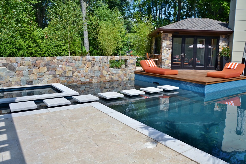 Hot tub - large backyard stone and rectangular lap hot tub idea in New York