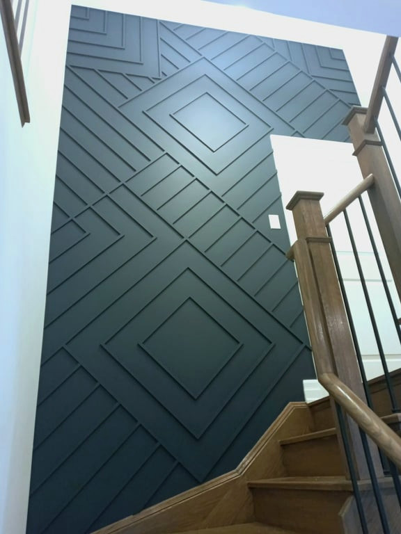Transitional wood wall hallway photo in Toronto with blue walls