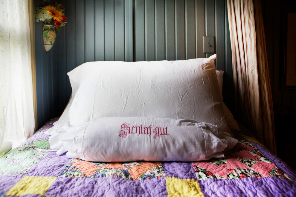 Example of a cottage bedroom design in St Louis