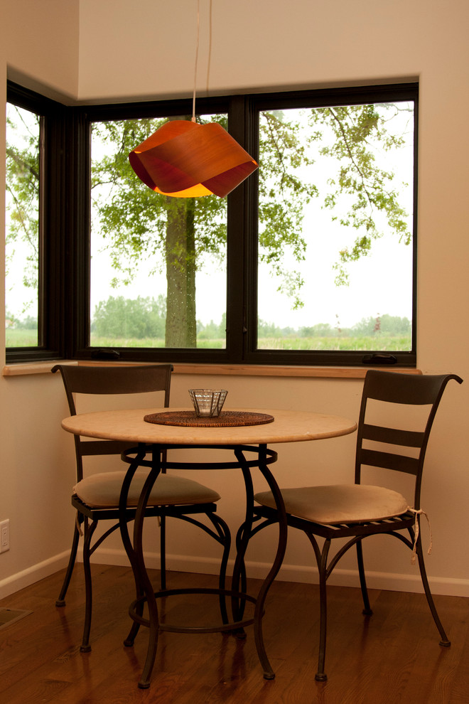 Kitchen/dining room combo - mid-sized modern medium tone wood floor and brown floor kitchen/dining room combo idea with white walls and no fireplace