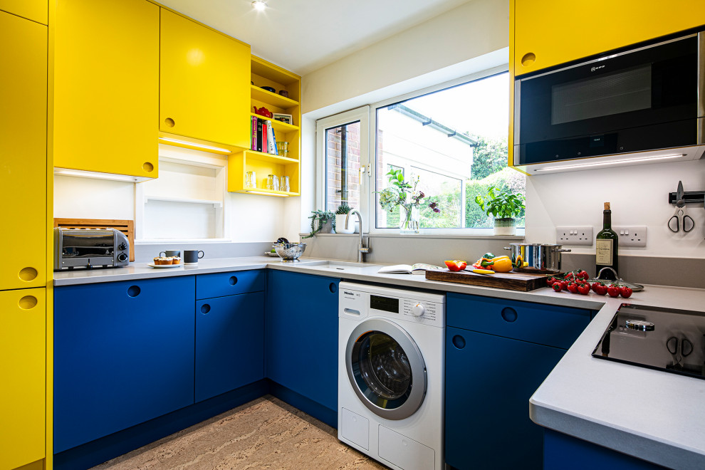 Inspiration for a small contemporary u-shaped enclosed kitchen in Other with flat-panel cabinets, yellow cabinets, quartz worktops, grey splashback, engineered quartz splashback, black appliances, cork flooring, no island, beige floors, grey worktops and feature lighting.