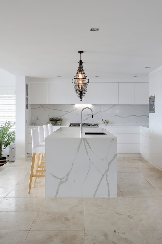 Inspiration for a contemporary eat-in kitchen in Sydney with quartz benchtops, white splashback, stone slab splashback, with island and white benchtop.